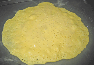 chickpea batter cooking in pan
