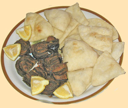 A plate of Puri and Patha, a savory Indian starter