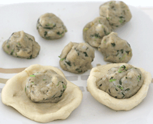 Potato Balls with a few added into the balls of dough