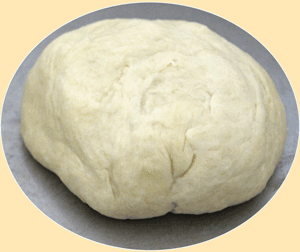 >Dough mixed into a round ball