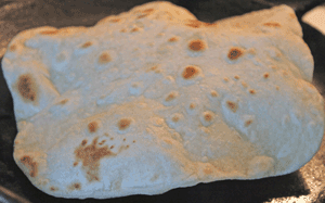 Roti rising as it cooks